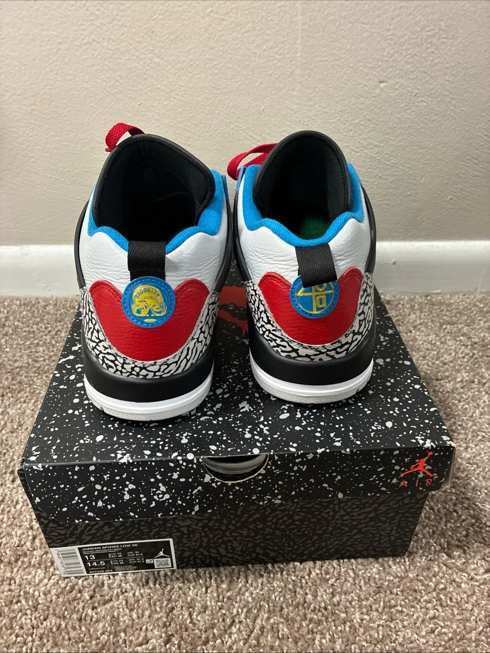 Jordan Men's White Athletic Shoes with Black, Red & Blue Accents